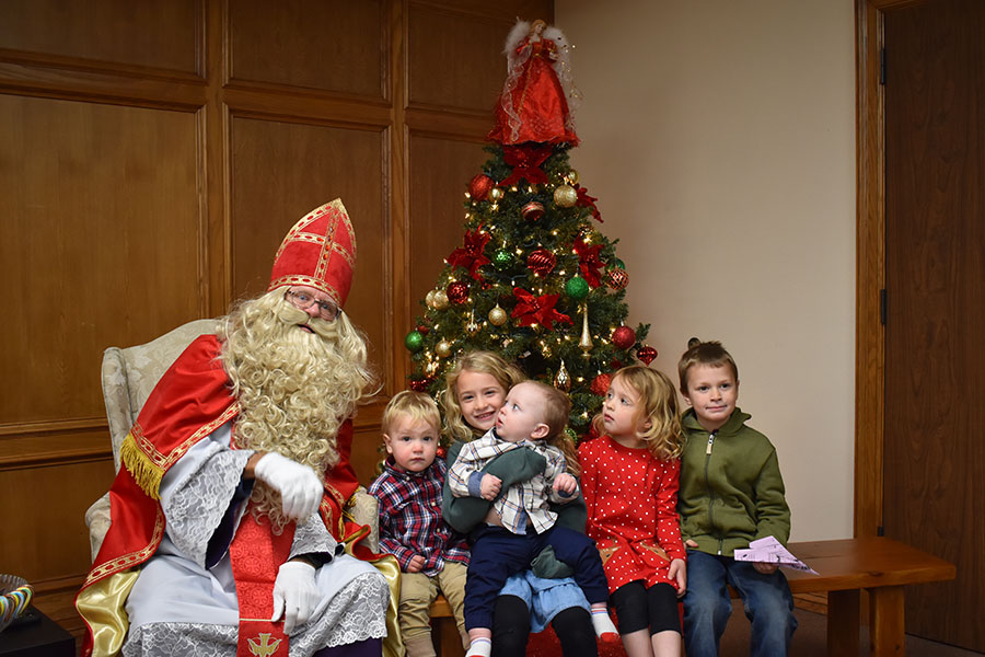 St. Nicholas poses with children of mixed reactions